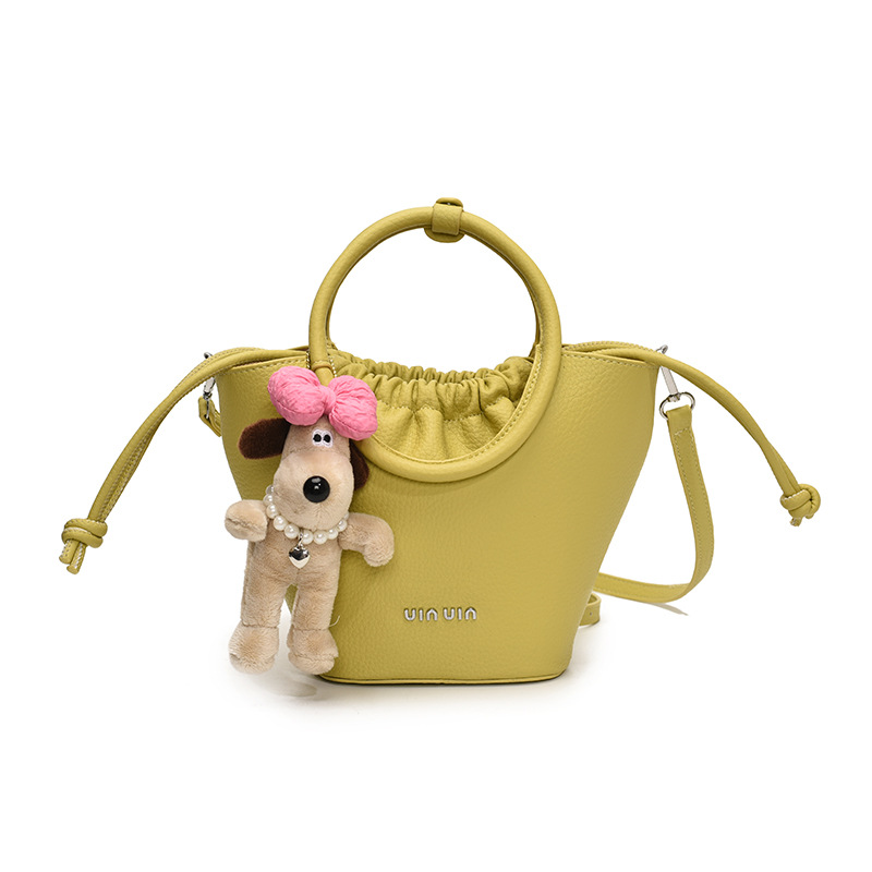 Bolsos de mano de nicho de tendencia transfronteriza para damas 2025 nuevo bolso de hombro simple de moda con textura bolso de cubo de todo fósforo