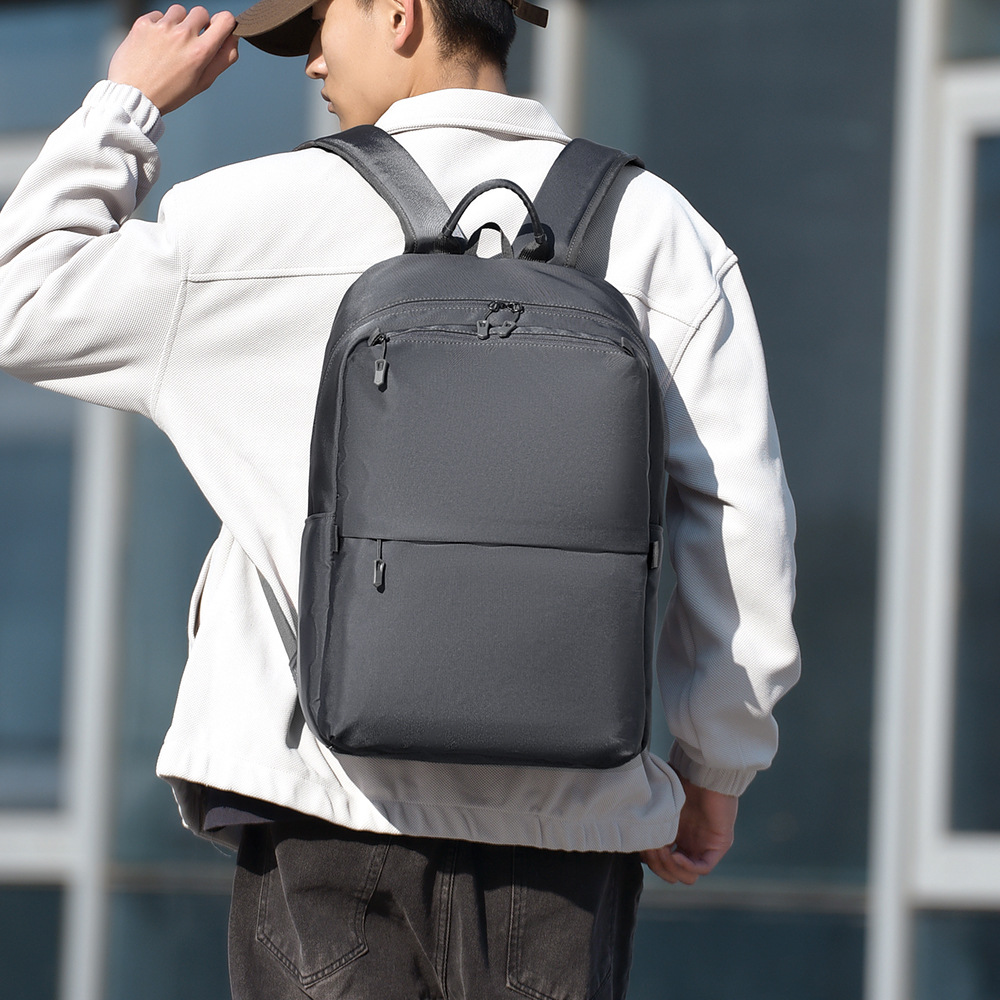 Mochila de negocios simple de hombre transfronteriza, mochila de estudiantes ligera transfronteriza de gran capacidad, mochila de moda a prueba de salpicaduras
