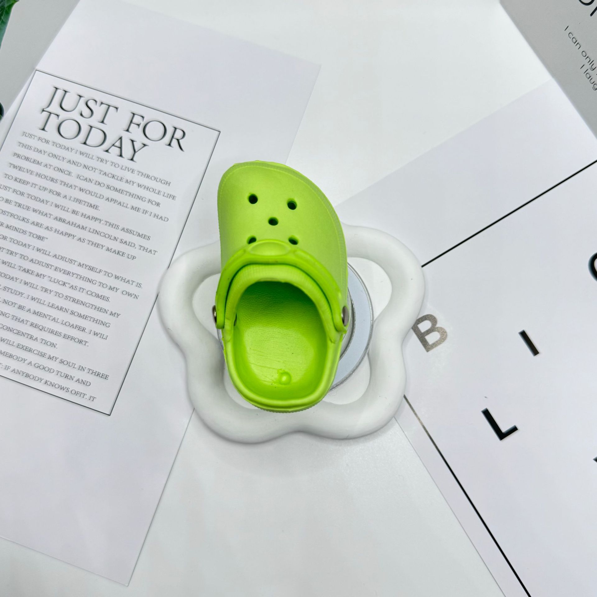 Green Crocs-style slippers