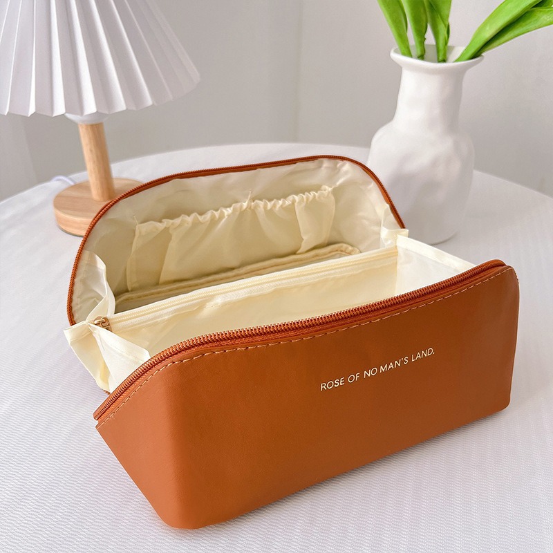 2025 nueva bolsa de cosméticos de celebridades de Internet ins bolsa de almohada de órgano bolsa de almacenamiento de Pu de gran capacidad caja de cosméticos lavado de viaje