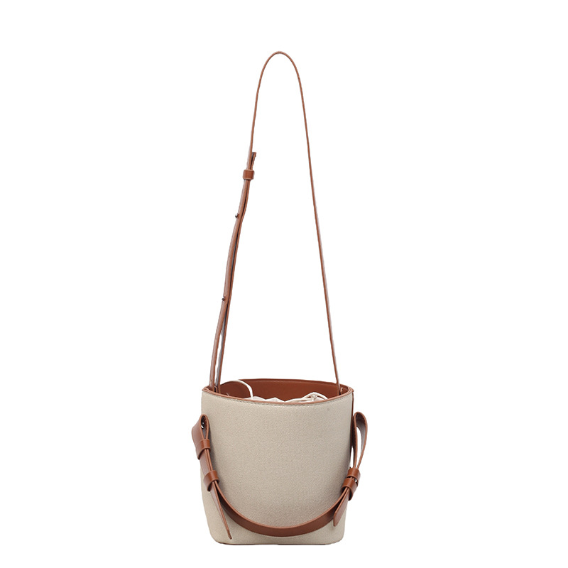 2025 nueva bolsa de cubo de lona de color de contraste para mujeres de alto nivel nicho de diseño de viaje de hombro portátil bolso de mano