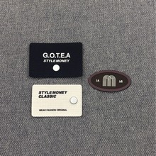 椭圆形字母m装饰标银色金属装饰黑白底色方形潮牌衣服裤子辅料