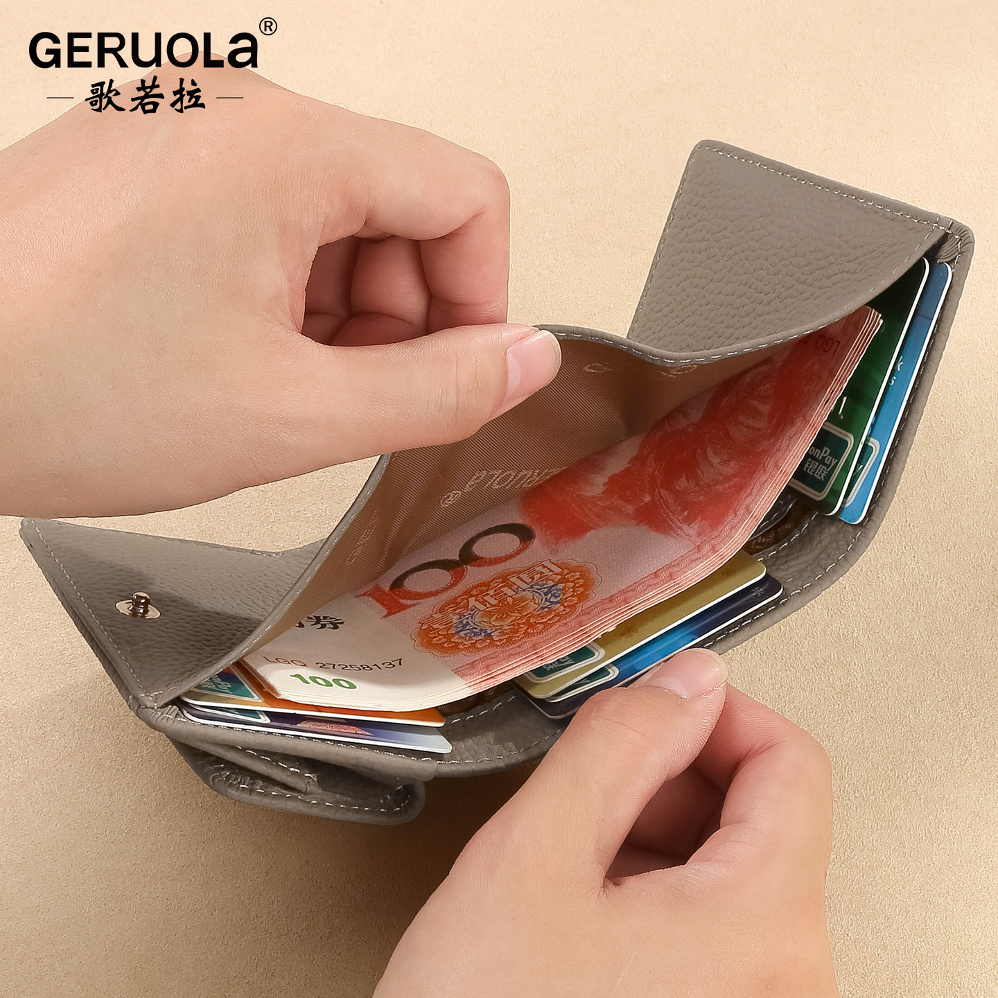 Comercio exterior nueva primera capa de cuero pequeño bolso de monedas de cuero real bolso de monedas de estilo japonés 2 plegable bolso corto de mujeres venta caliente