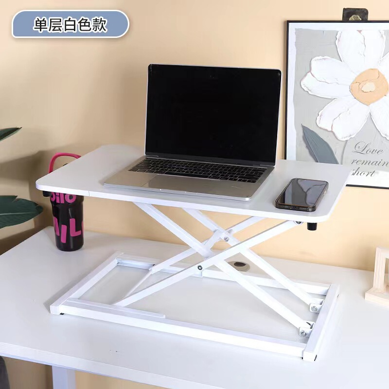 気動机の上のコンピュータの机は立式の事務室の台の上に立って高くなるノートの折り畳みの机で机を昇降することができます。|undefined