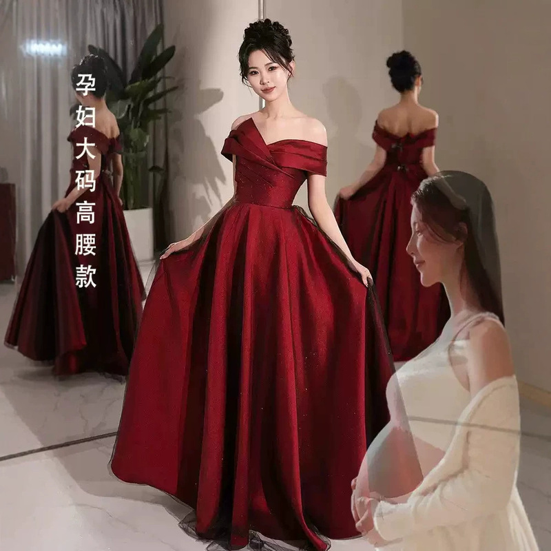 Burgundy off-shoulder maternity evening dress, plus size, high-waisted, for weddings, bridal receptions, and engagement parties, with tummy-concealing design Burgundy off-shoulder maternity evening dress, plus size, high-waisted, for weddings, bridal receptions, and engagement parties, with tummy-concealing design