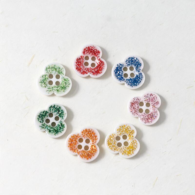 Hot-selling clover-shaped glitter plastic buttons, direct wholesale from manufacturer of children's and women's clothing accessories Hot-selling clover-shaped glitter plastic buttons, direct wholesale from manufacturer of children's and women's clothing accessories
