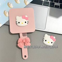新しい種類のKitty猫のハンドルの鏡は櫛を持って携帯します。
