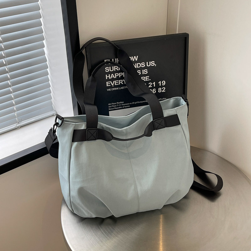 Bolsos de viaje transfronterizos de gran capacidad Bolsos de tela Oxford simples de moda femenina Bolsos tote de todo fósforo Bolsos de hombro de moda coreana