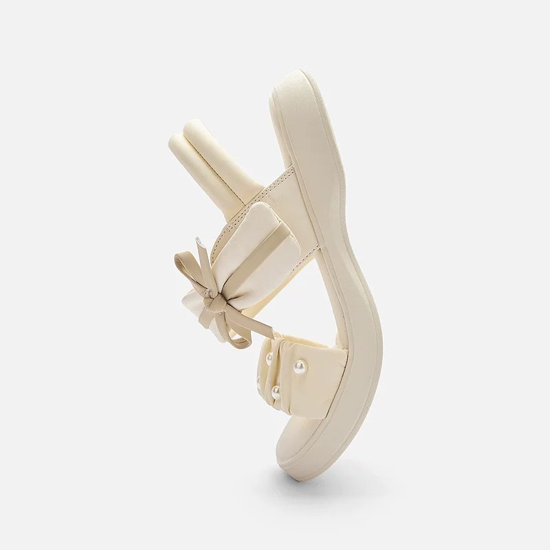 Zapatos de playa de moda de niñas versátiles 2026 verano nuevos zapatos de arco para niños Lefour zapatos de princesa huecos