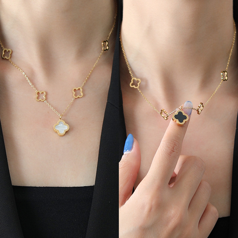 Cuatro hojas de hierba no se desvanecen pulsera de alta versión lujosa ligera en blanco y negro de doble cara oro lujosa joyería lujosa transfronteriza alta sensación conjunto