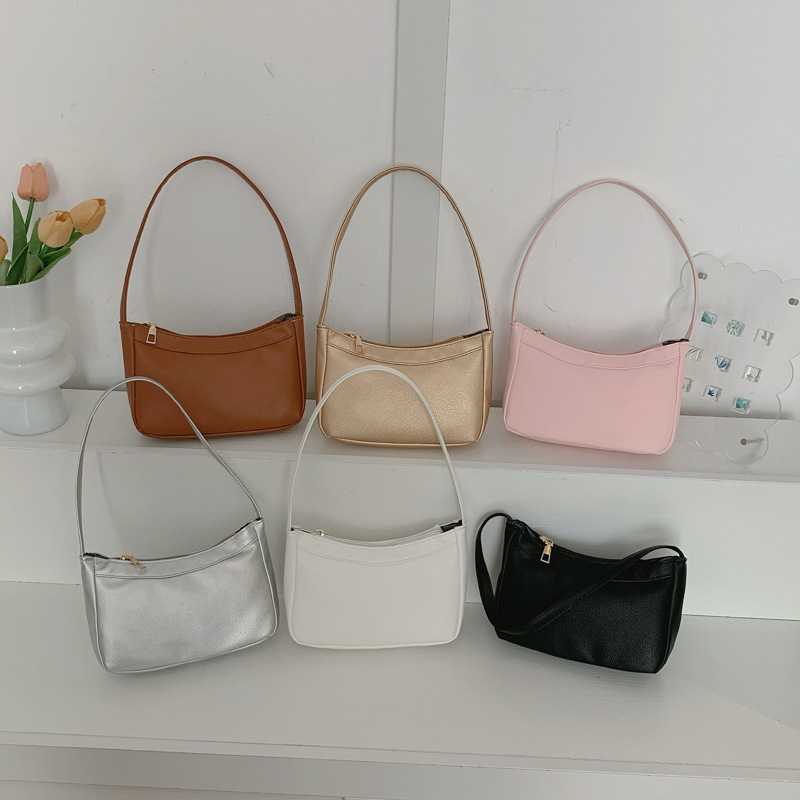 Bolsos de hombro coreanos para niños y niñas, bolsos de moda de color sólido, bolsos portátiles compactos y ligeros, 2026 nuevas bolsas para niños transfronterizas, bolsos de moda