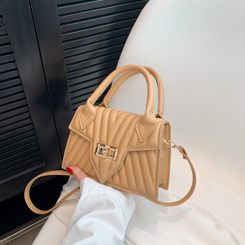 Textura 2025 nueva moda de impresión de estilo extranjero rotary-lock mochila de hombro casual color caramelo bolso de mano de mujer