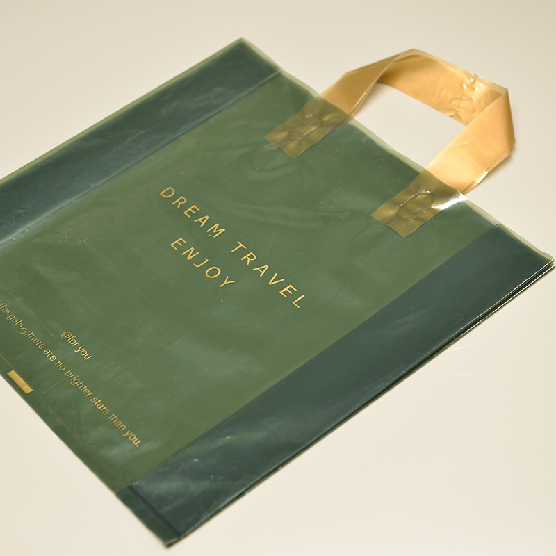 Waterproof green transparent hand-holding hook universal packaging new material baking plastic bag clothing store bags wholesale