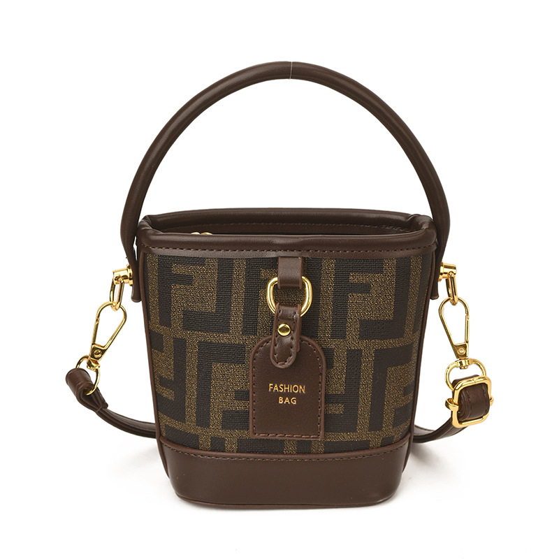 Mini pequeño bolso de cubo de mano para niños 2026 nuevo estilo de alta calidad de moda versátil bolso de mochila de estilo exterior