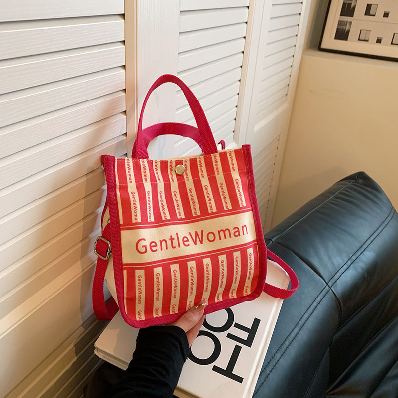 Moda rayas bolsa de lona para mujeres 2023 nueva carta impresión portátil bolsa de compras bolso de hombro al por mayor