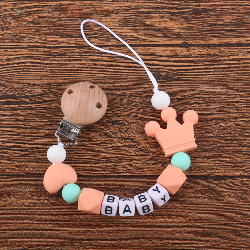 Nuevo bebé haya chupete clip calmante bebé corazón corona de silicona mordedura molar Cadena de chupete cadena anti-caída