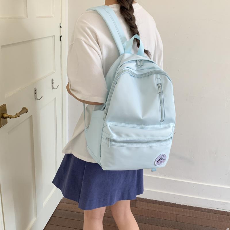 Highly stylish, simple, solid-color backpack in college style for female high school and college students, lightweight and large-capacity for daily use