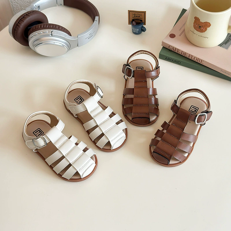 2025 лето новый детский баотоу римские туфли крутая девушка европейский и американский ветер полые сандалии девушки полые пляжные туфли