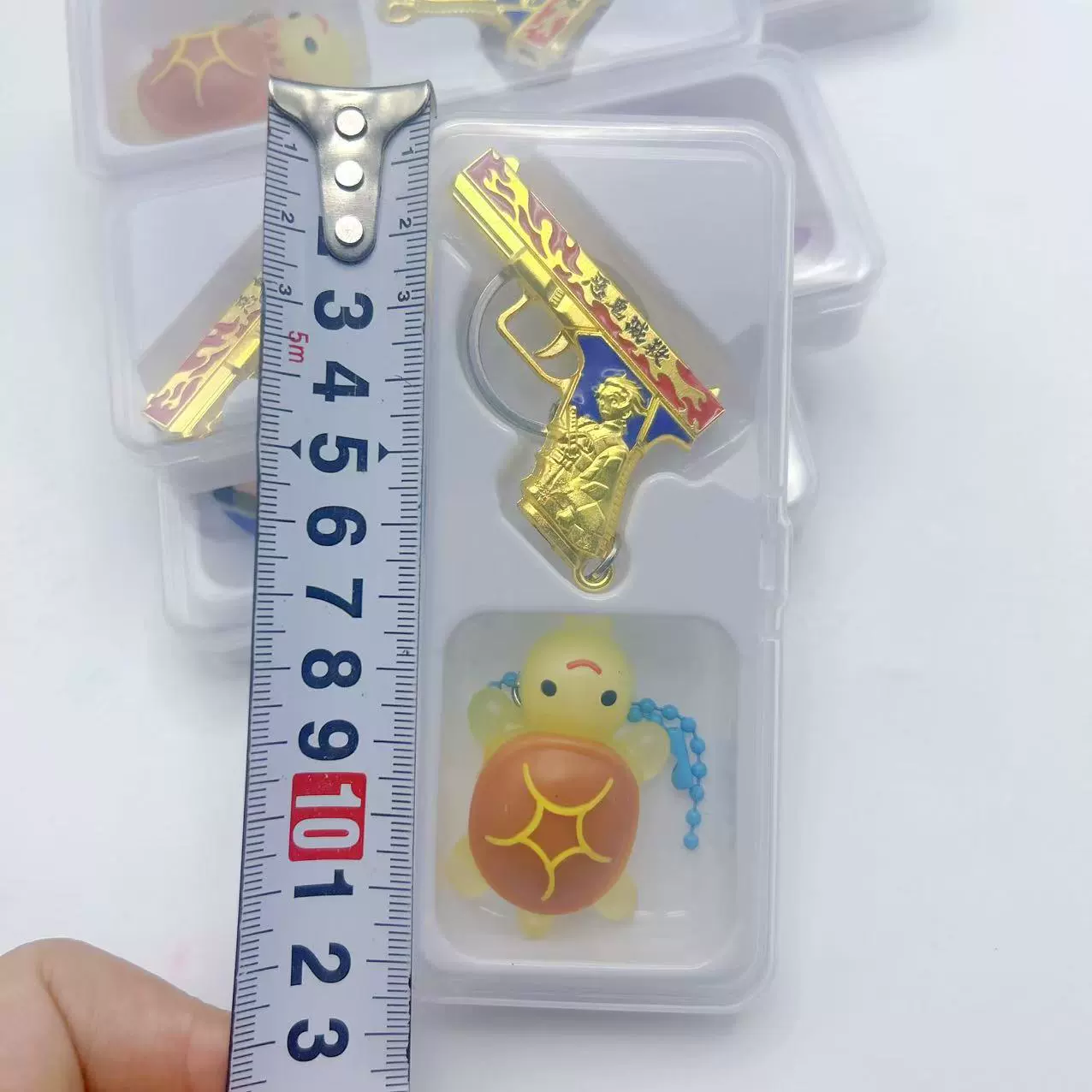  Painted metal weapon, pendant, toy