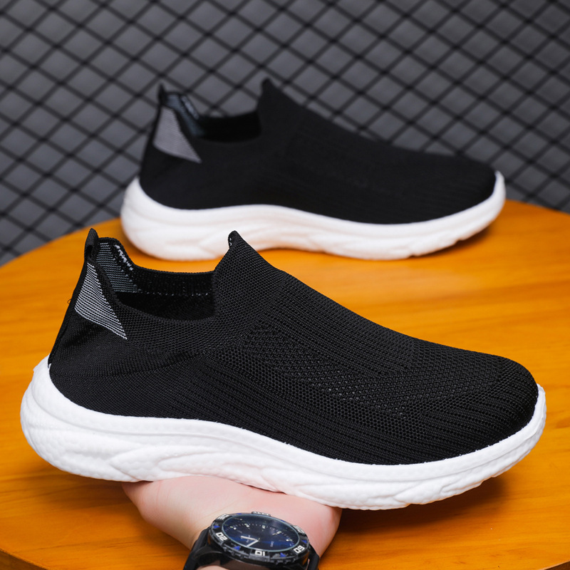 Zapatos de hombre transfronterizos perezosos de un pie 2025 primavera y verano malla zapatos de hombre zapatos casuales zapatos de todo fósforo de color sólido de fondo suave tejido volador