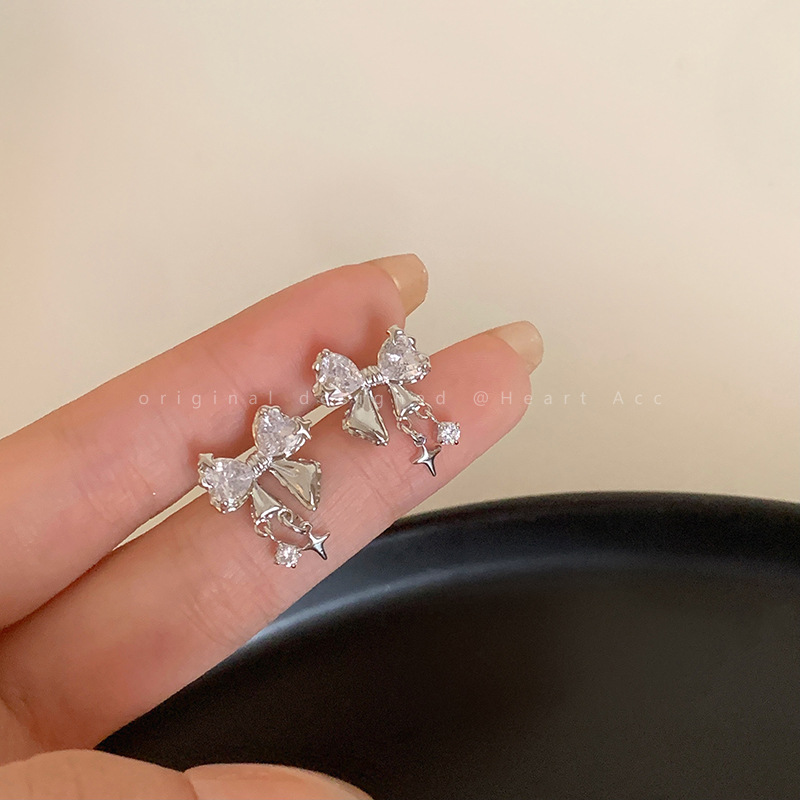 Small design fashionable elegant earrings with bow with zircon