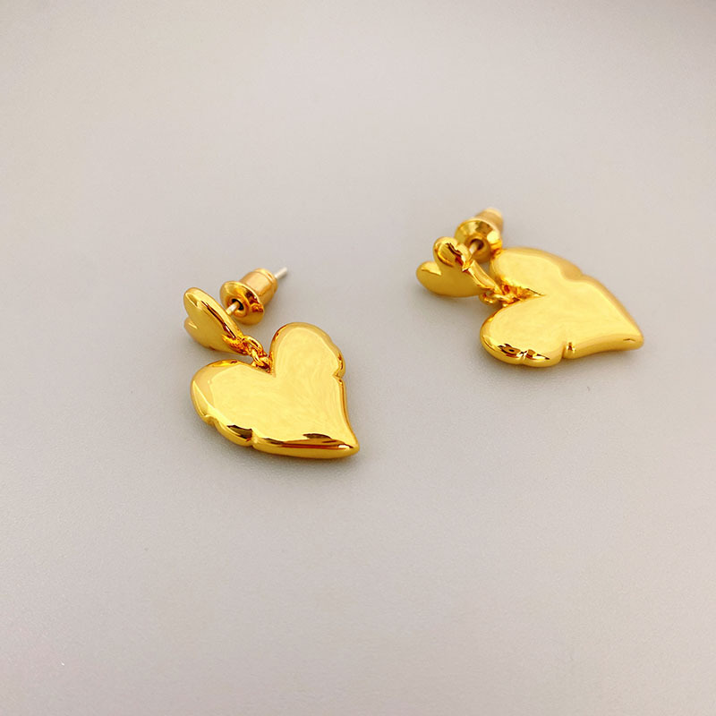 glossy small brass earrings heart shaped