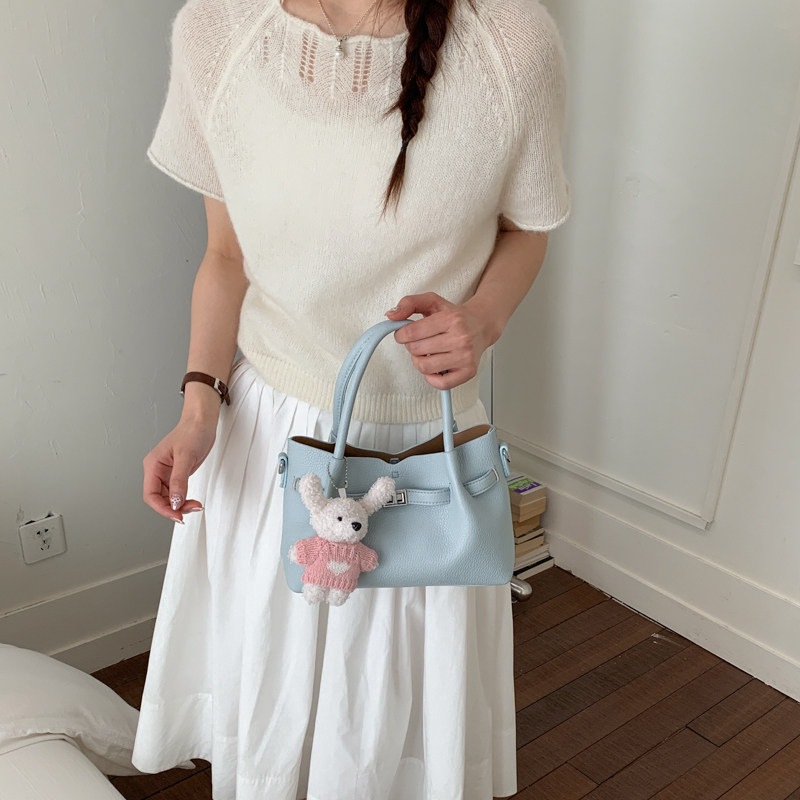 Simple portátil 2026 diseño de bolso de hombro único versátil estilo coreano de transporte de moda nuevo bolso de cubo nicho femenino