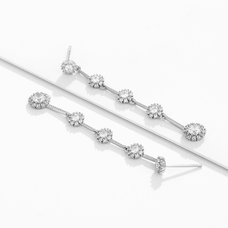 Xupin joyería aleación con incrustaciones pendientes de girasol temperamento femenino largo borla pendientes de hadas joyería al por mayor