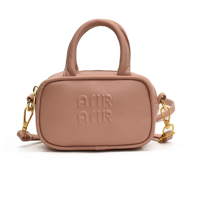 2025 nuevo bolso infantil coreano simple color sólido letras extranjeras bolso bebé mini bolso de bolos para niños
