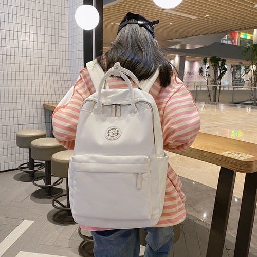 双肩包女2023简约休闲甜美背包可爱纯色大容量韩版学生马卡龙书包