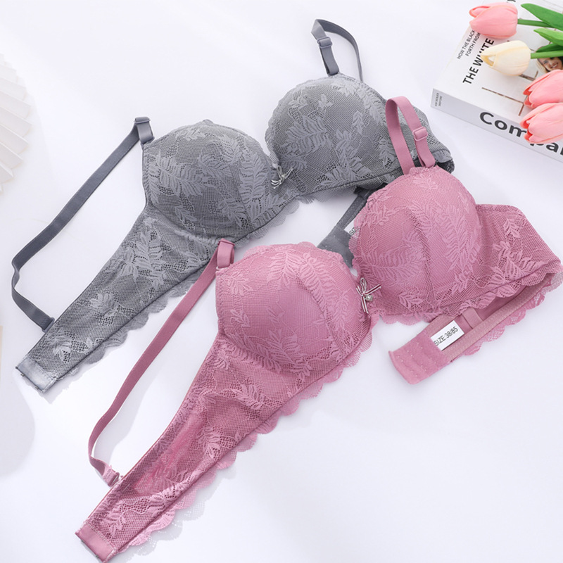 Fábrica de stock pequeño pecho grueso sujetador sexy encaje reunido ropa interior de mujer con anillo de acero sobre el bra de caída