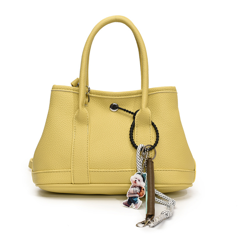 Nicho de moda explosivo bolso de cubo portátil para mujeres 2025 nuevo estilo universal simple bolso de mochila de moda extranjera bolso de mochila