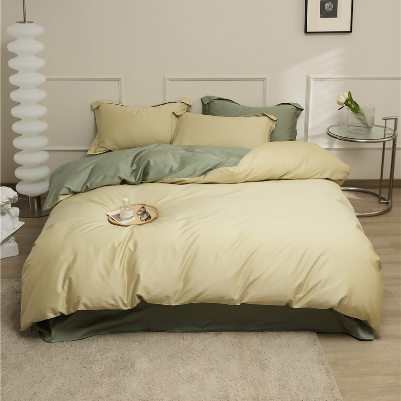 Set di lusso a quattro pezzi in puro cotone a fibra lunga 100, con blocchi di colore semplici: copripiumino, lenzuolo e gonna da letto. Nantong Home Textiles._voghion.com