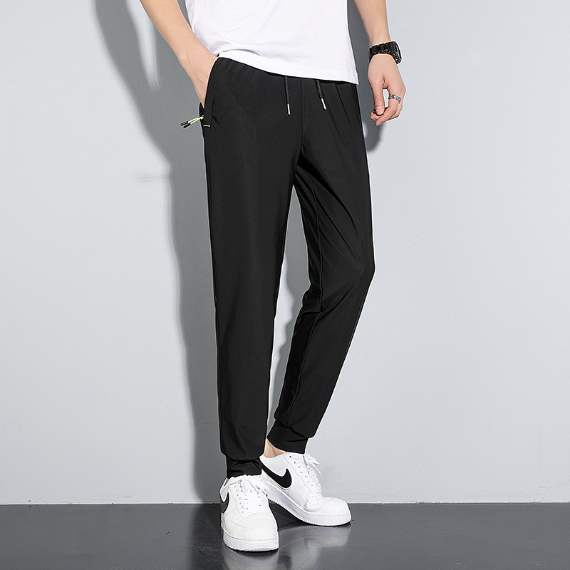 Pantalones delgados de verano de los hombres de ocio pantalones largos Pantalones deportivos elásticos de secado rápido hombres sueltos fertilizantes más tamaño al por mayor