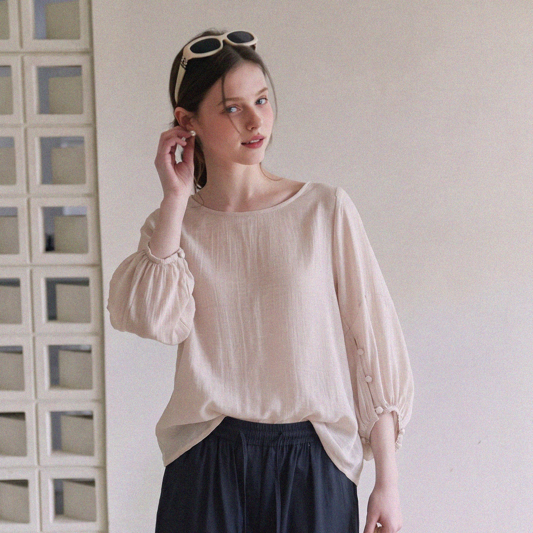 French-style beige lantern sleeve blouse for women, unique and beautiful, with a relaxed and effortless feel.