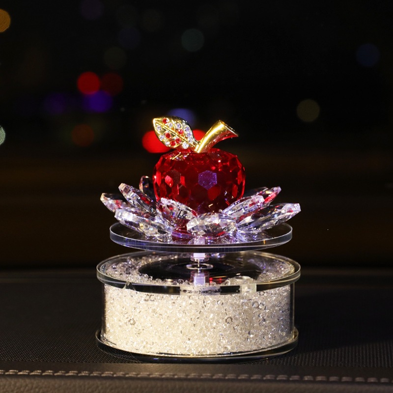 Solar-powered rotating crystal apple car-mounted lotus perfume holder ornament, elegant and feminine car interior accessory for the dashboard