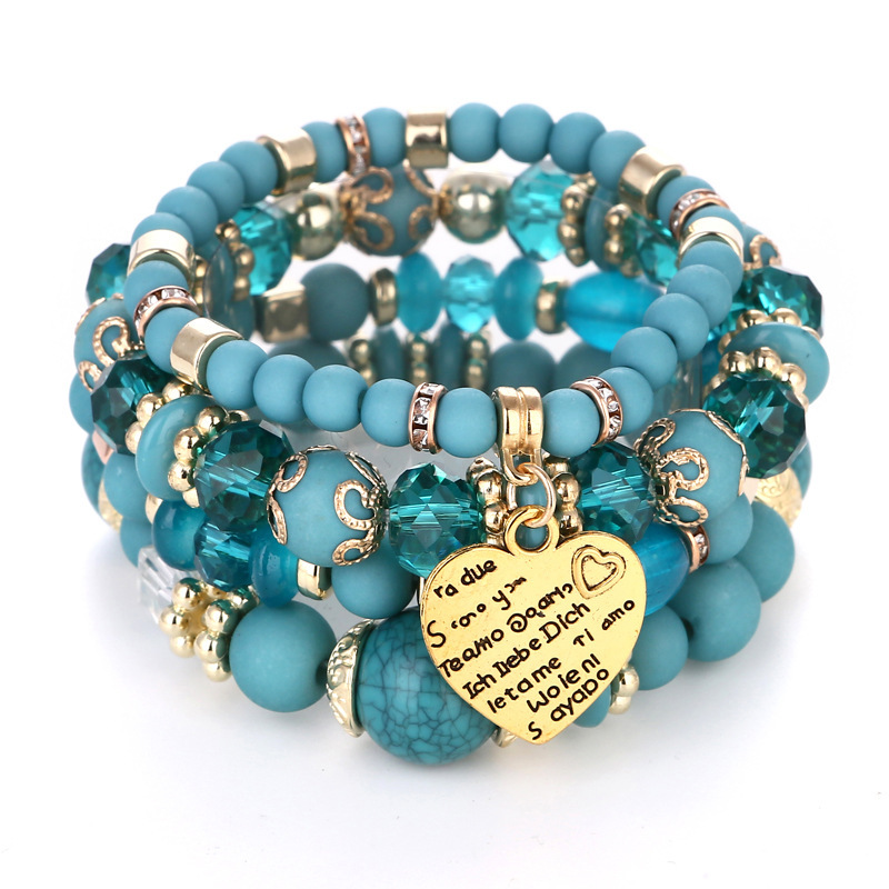 Bohemian-style ethnic bracelet for women, featuring a multi-layered design with turquoise and colorful rice beads, a beaded bracelet set