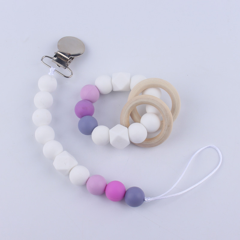 Nuevos suministros para bebés Cadena de chupete DIY creativo contraste color cuentas de silicona mordedor anti-caída traje de cadena