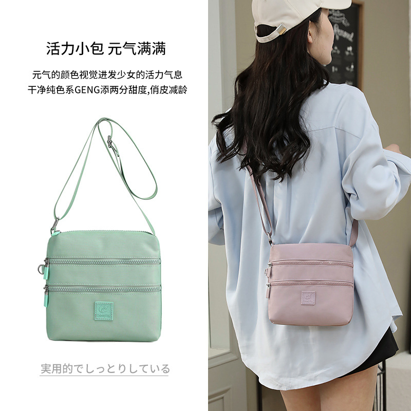 Bolsos de tela pequeños al por mayor, bolsos de nylon, bolsos de hombro para mujeres, tendencia coreana, mochilas ligeras al aire libre, bolsos de tela prácticos de varias capas