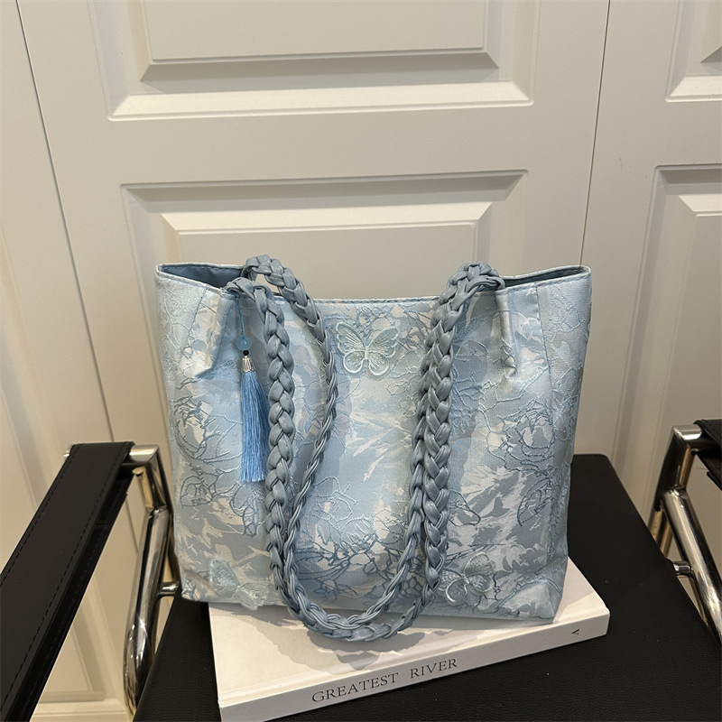 Bolso de viaje de seda de mariposa de alta calidad de nicho 2025 verano nuevo bolso de mujer simple de gran capacidad nuevo estilo chino