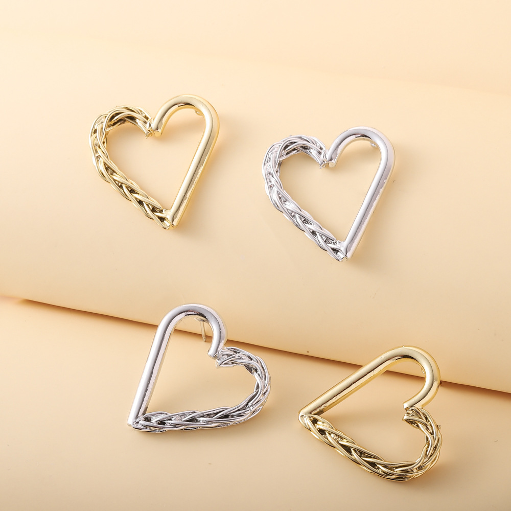 Simple Style Asymmetric Hollow Heart-shaped Metal Stud Earrings display picture 3