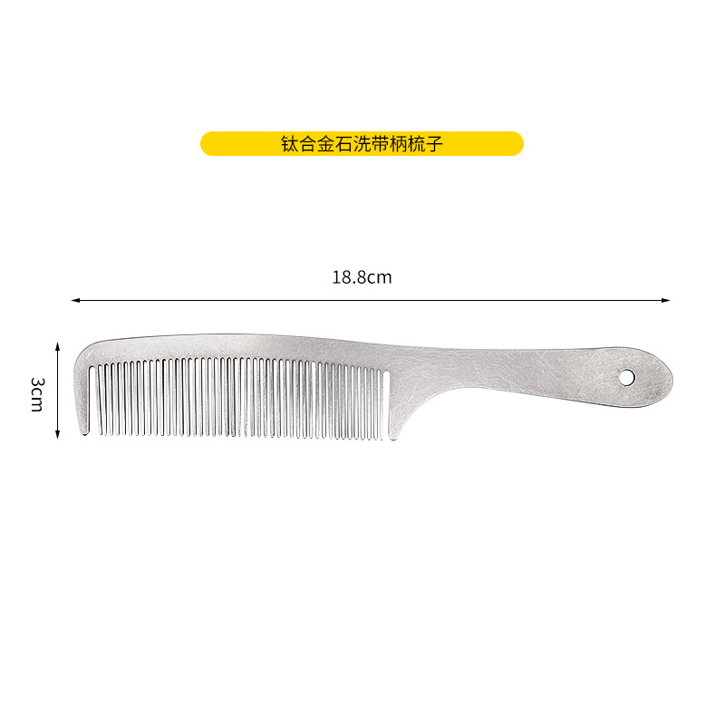 손잡이가있는 돌로 씻은 빗