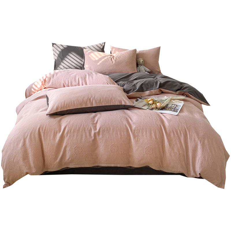 Un juego de cuatro piezas de algodón lavado de algodón de clase 100 hilo de tres capas de algodón puro sábana de lujo simple y ligera cubierta de edredón ropa de cama