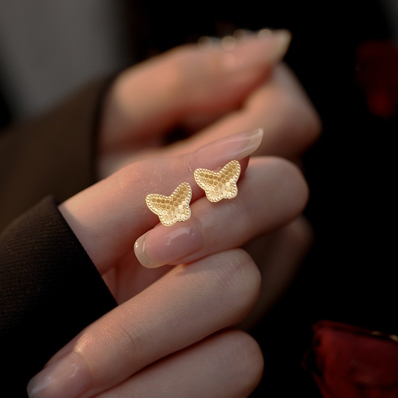 Pendientes de flores tridimensionales con lentejuelas de aguja de plata Pendientes de lujo ligero de alta gama de moda de nicho Pendientes de viento frío al por mayor