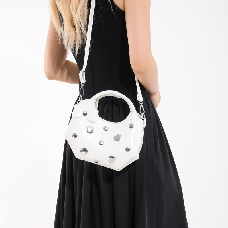 Bolso de alta calidad con textura 2025 verano nuevo bolso femenino moda bowknot bandolera personalidad remache bandolera