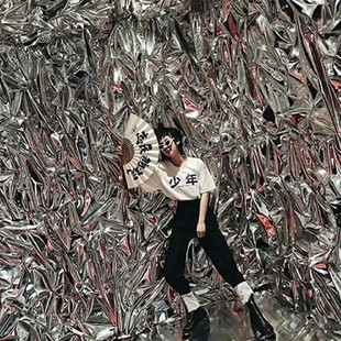 Ginger steamed silver reflective light mirror water ripple pleated tin film Paper Street dance table background wall layout Studio Photography