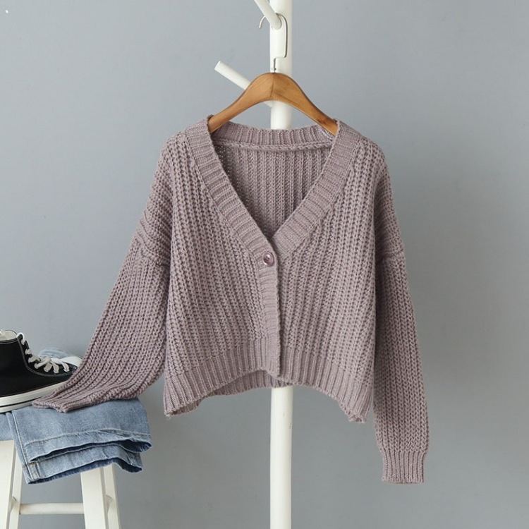 Comercio exterior de otoño suministro transfronterizo de ropa de mujer europea y americana botón de punto de manga larga cardigán de color sólido suéter suelto de cuello en V