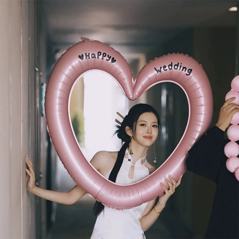Wedding, marriage registration, engagement, photo shoot, pink hollowed-out oversized heart-shaped photo frame, bow, balloons, wedding photo props Wedding, marriage registration, engagement, photo shoot, pink hollowed-out oversized heart-shaped photo frame, bow, balloons, wedding photo props