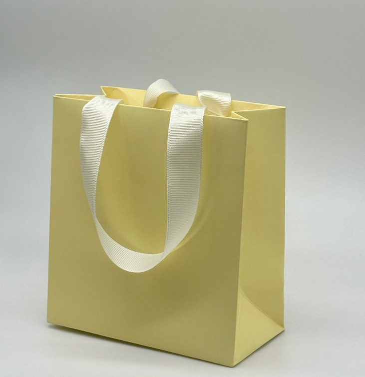 Bolsa de mano amarilla; bolsa pequeña: 23 * 10 * 20cm