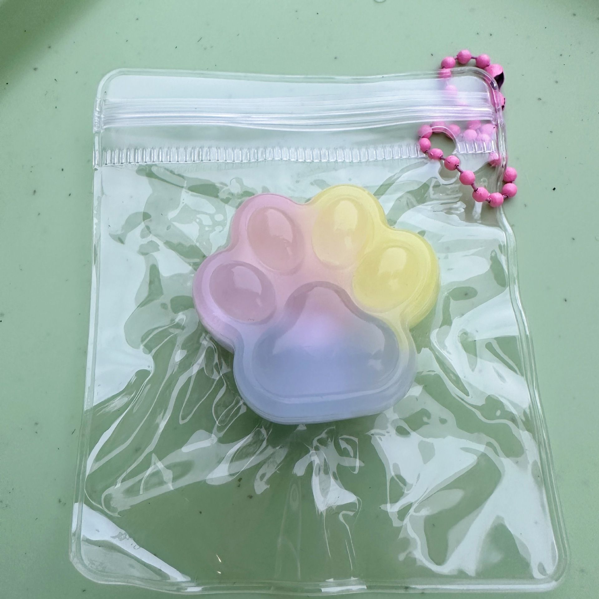Three-color cat paw with small nose